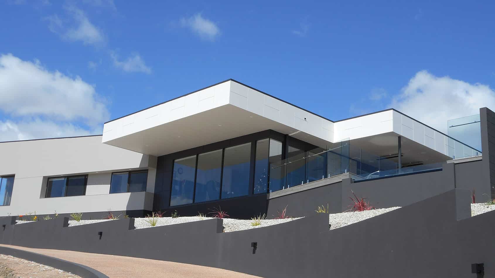 Contemporary residence showcasing INNOVA Duragrid expressed joint fibre cement cladding in a sleek, geometric pattern