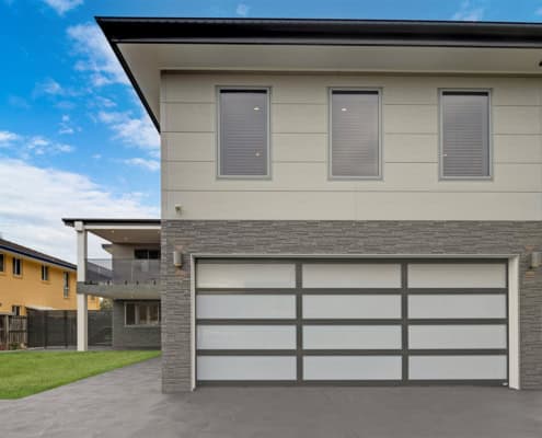 Modern home featuring INNOVA Montage® cladding in Concrete and Stackstone profiles, combining texture and clean lines for a durable, architectural finish.